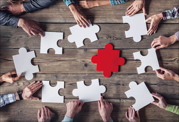 Hipster business successful teamwork concept  business group assembling jigsaw puzzle