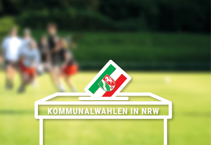 Unscharfe photografietes Spielfeld mit eine illustrierten Wahlurne davor
