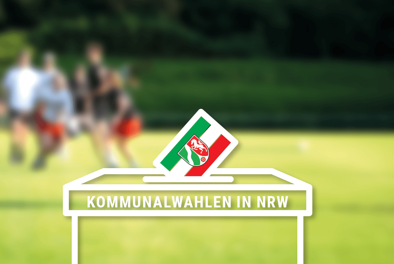 Unscharfe photografietes Spielfeld mit eine illustrierten Wahlurne davor